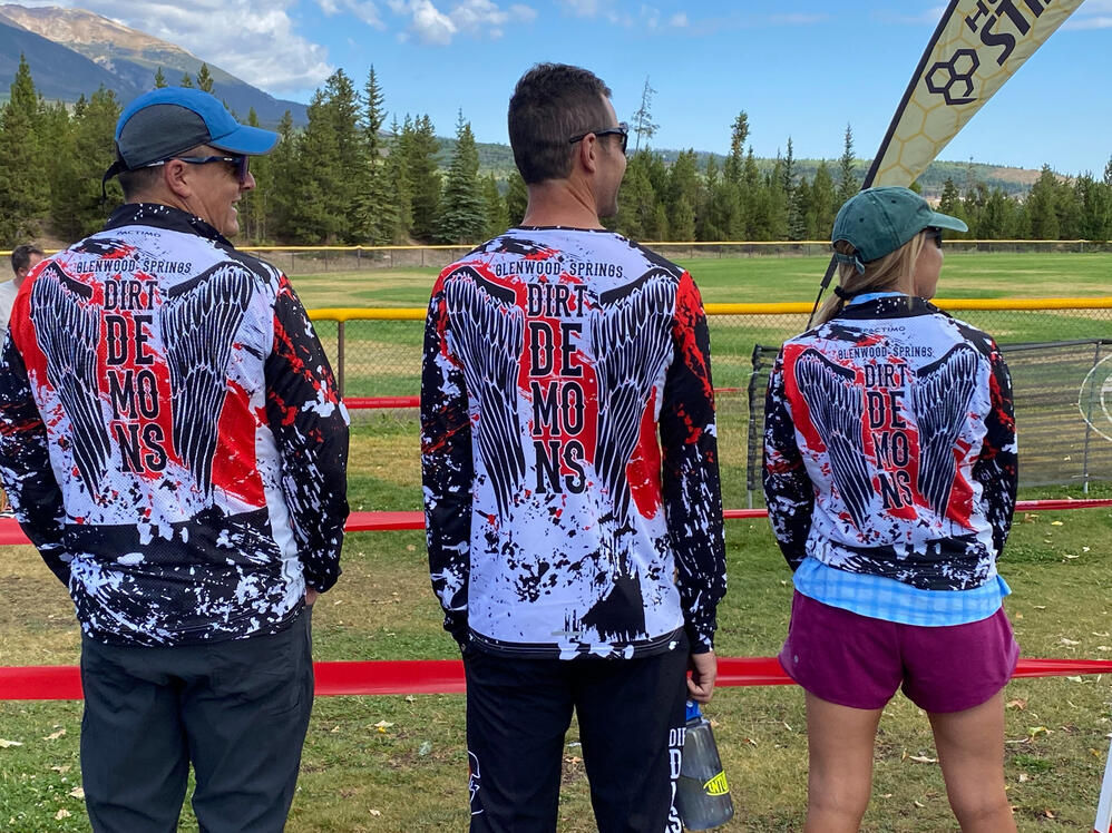 Dirt Demons coaches waiting for racers to ride by